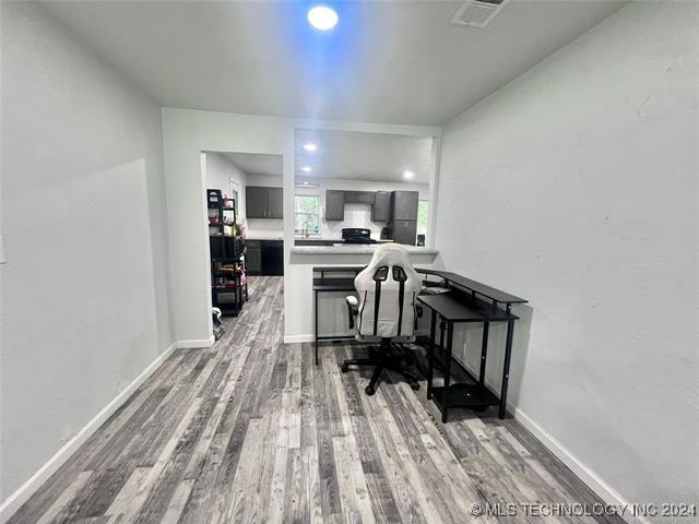 office area with hardwood / wood-style floors