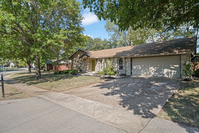 single story home featuring a garage