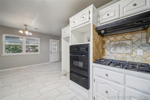 kitchen with tasteful backsplash, ventilation hood, white cabinetry, oven, and stainless steel gas stovetop