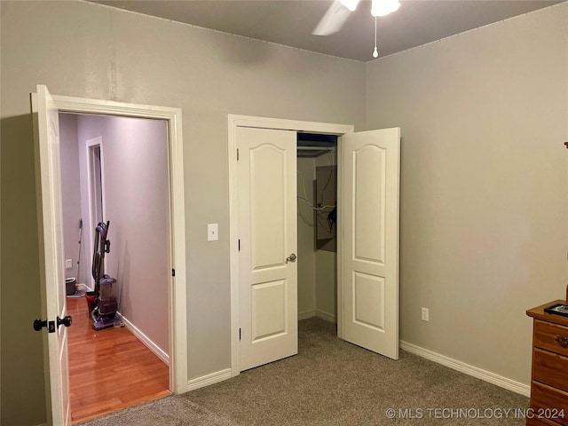 unfurnished bedroom featuring carpet and ceiling fan