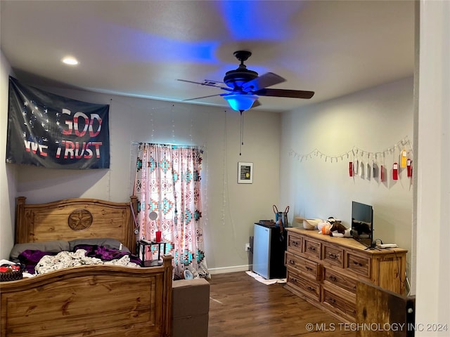 bedroom with dark hardwood / wood-style floors and ceiling fan