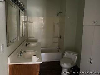 full bathroom with vanity, toilet, and shower / washtub combination