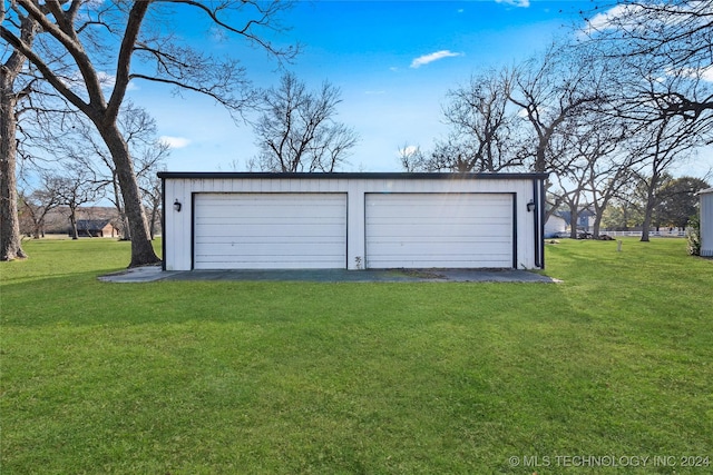 garage with a lawn