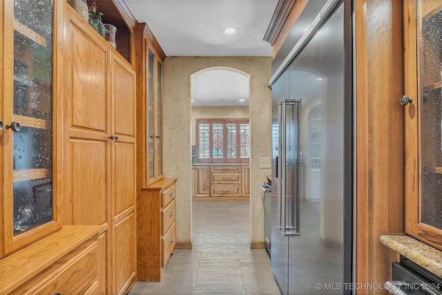 hallway with light tile patterned floors