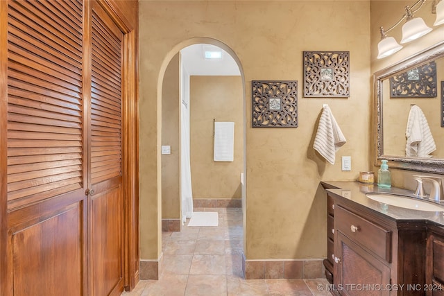 bathroom with tile patterned floors and vanity