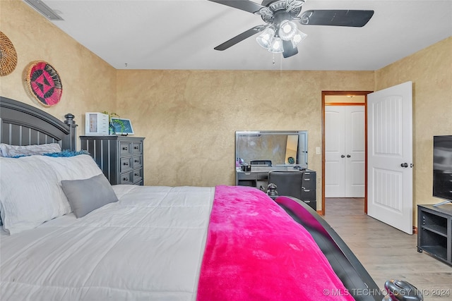 bedroom with ceiling fan and light wood-type flooring