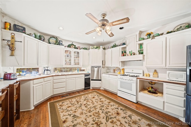 kitchen featuring white appliances, dark hardwood / wood-style floors, white cabinetry, and ceiling fan