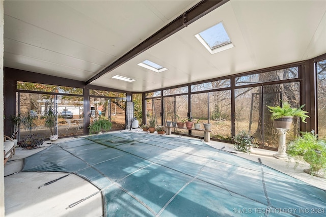 view of pool with a skylight