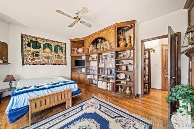 bedroom with hardwood / wood-style floors and ceiling fan