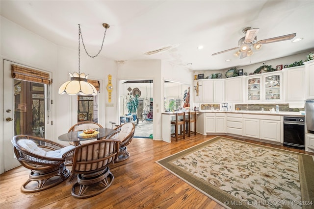 dining area featuring ceiling fan and light hardwood / wood-style floors