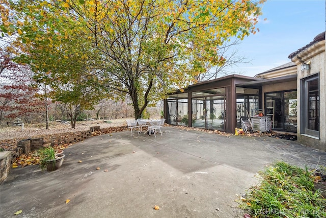 view of patio / terrace with a sunroom