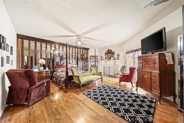 bedroom with wood-type flooring and ceiling fan