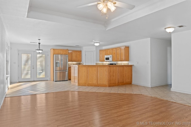 kitchen featuring french doors, kitchen peninsula, light wood-type flooring, decorative light fixtures, and stainless steel fridge with ice dispenser