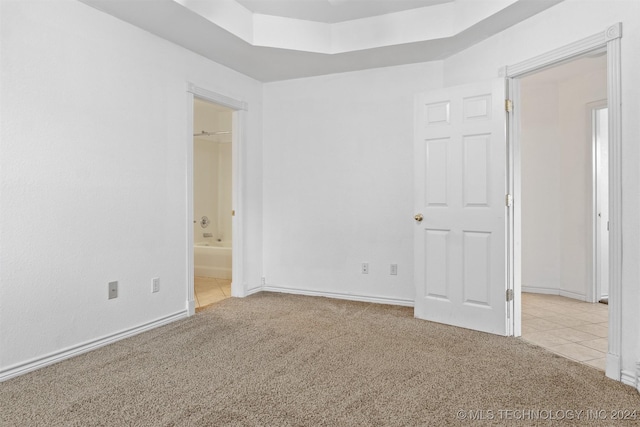 unfurnished room with light colored carpet