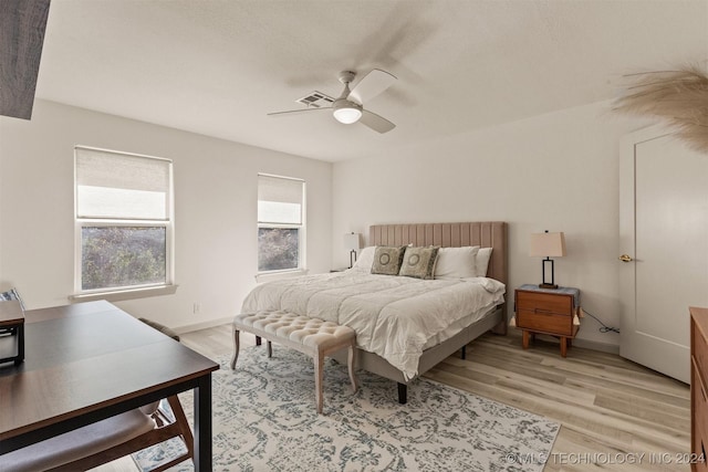 bedroom featuring light hardwood / wood-style flooring and ceiling fan