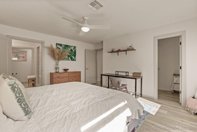 bedroom featuring light hardwood / wood-style floors and ceiling fan