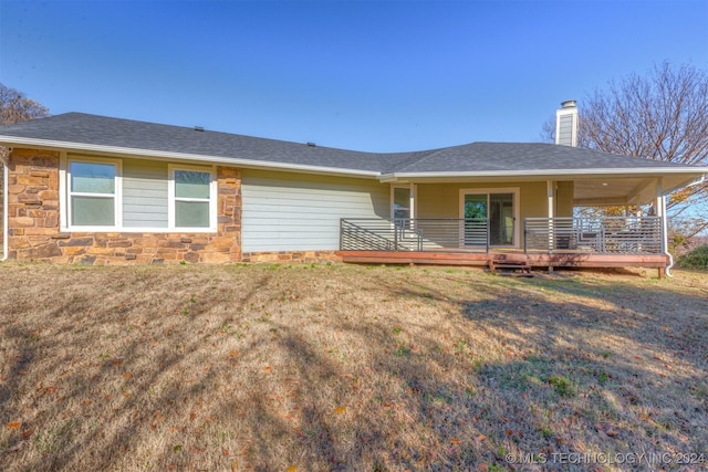 exterior space featuring a yard and a wooden deck