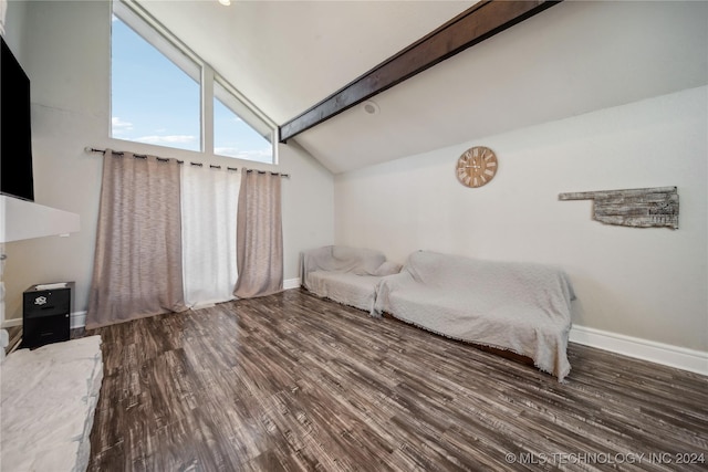 bedroom with beamed ceiling, hardwood / wood-style floors, and high vaulted ceiling