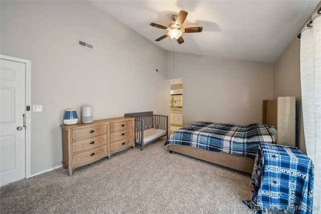 carpeted bedroom featuring ceiling fan, high vaulted ceiling, and connected bathroom