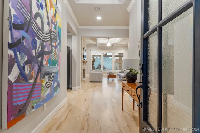 hall with beamed ceiling, hardwood / wood-style floors, crown molding, and coffered ceiling