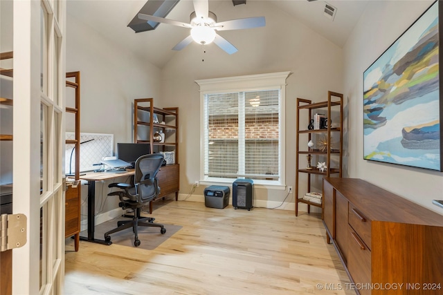 office area with light wood-type flooring, ceiling fan, and lofted ceiling