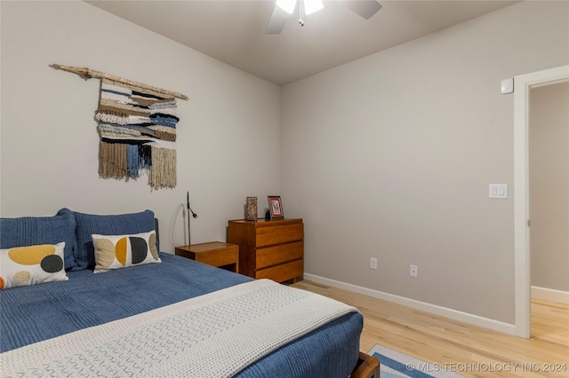 bedroom with hardwood / wood-style flooring and ceiling fan