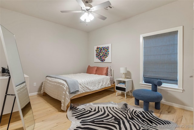 bedroom featuring ceiling fan and light wood-type flooring