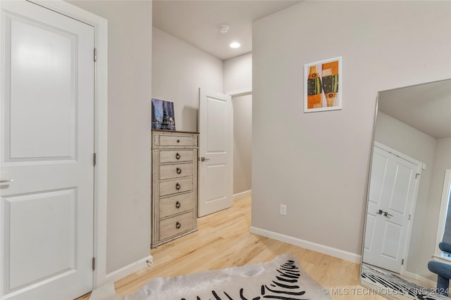 hallway featuring hardwood / wood-style flooring