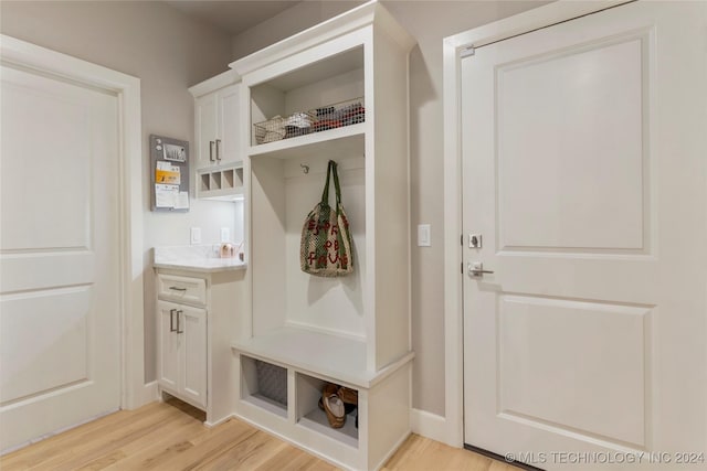 mudroom with light hardwood / wood-style floors