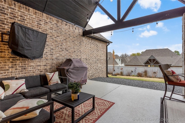 view of patio / terrace featuring an outdoor living space and area for grilling