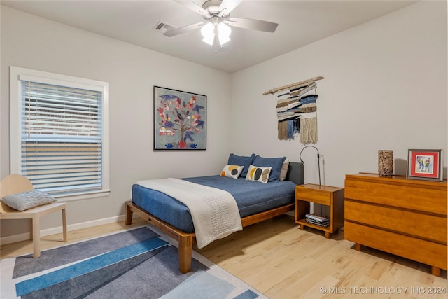 bedroom featuring hardwood / wood-style flooring and ceiling fan