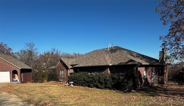 view of property exterior with a lawn