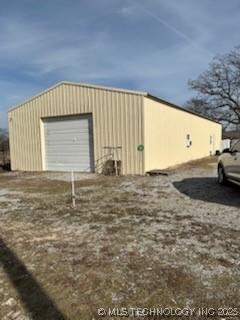 view of outbuilding featuring a garage