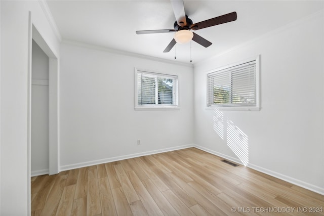 unfurnished bedroom with ceiling fan, light hardwood / wood-style floors, and ornamental molding