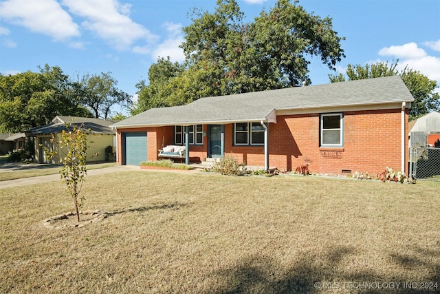 single story home featuring a front yard and a garage