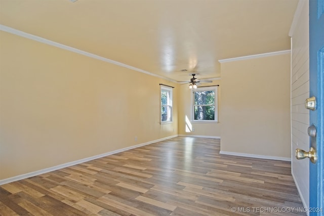 unfurnished room with ceiling fan, light hardwood / wood-style floors, and ornamental molding