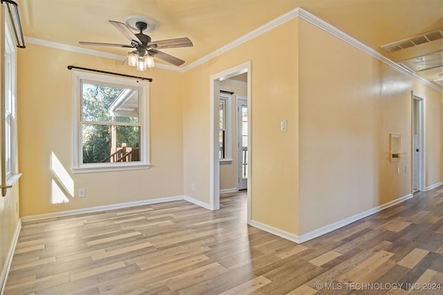 empty room featuring ceiling fan, crown molding, and light hardwood / wood-style flooring