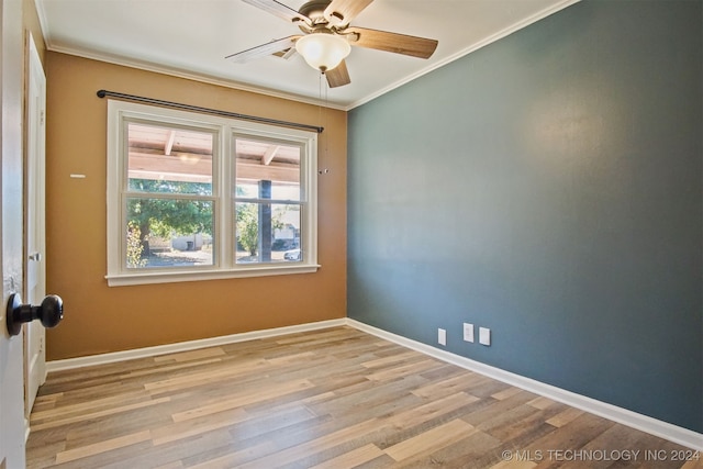 empty room featuring light hardwood / wood-style floors, ceiling fan, and ornamental molding