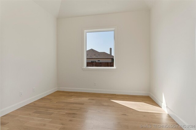 empty room with light wood-type flooring