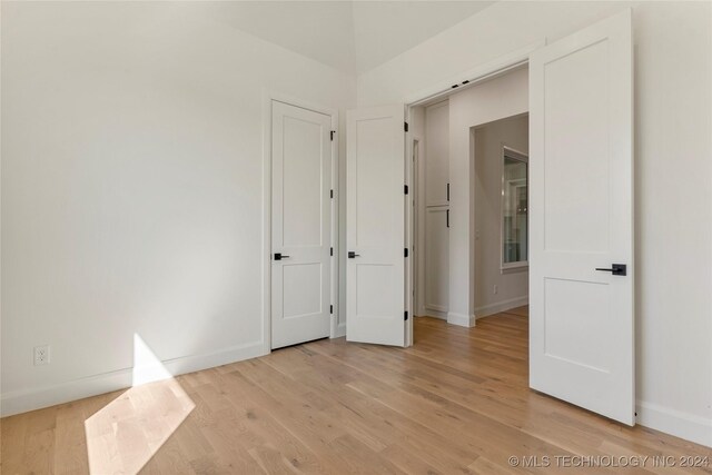 spare room featuring light hardwood / wood-style floors