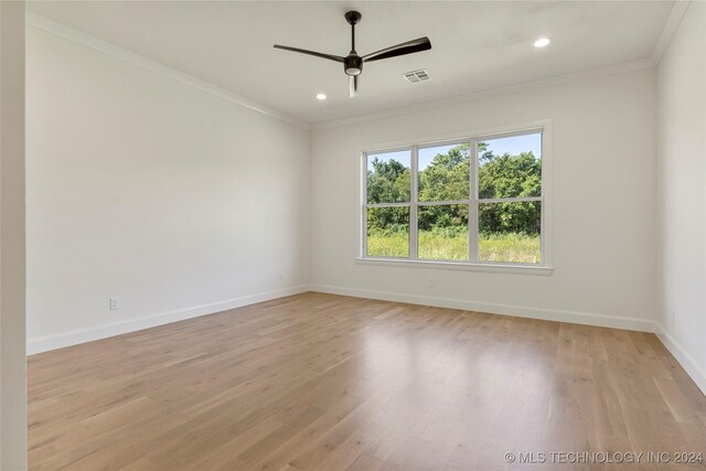 unfurnished room with light hardwood / wood-style floors, ceiling fan, and ornamental molding