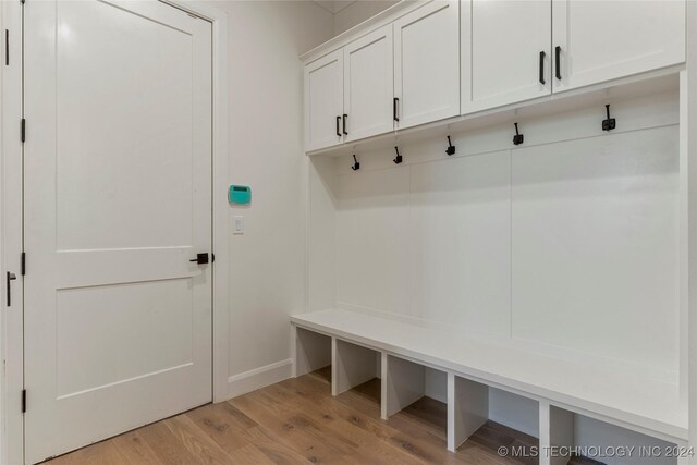 mudroom with light hardwood / wood-style flooring