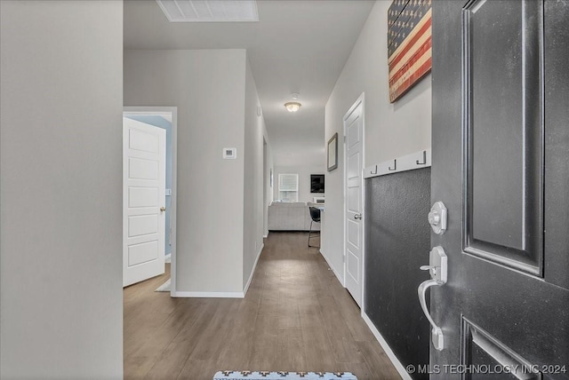 corridor featuring hardwood / wood-style flooring