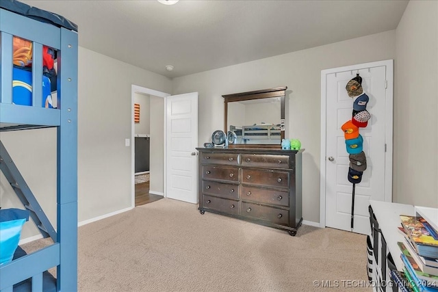 bedroom featuring light colored carpet