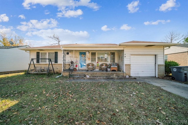 single story home with a front lawn, covered porch, and a garage