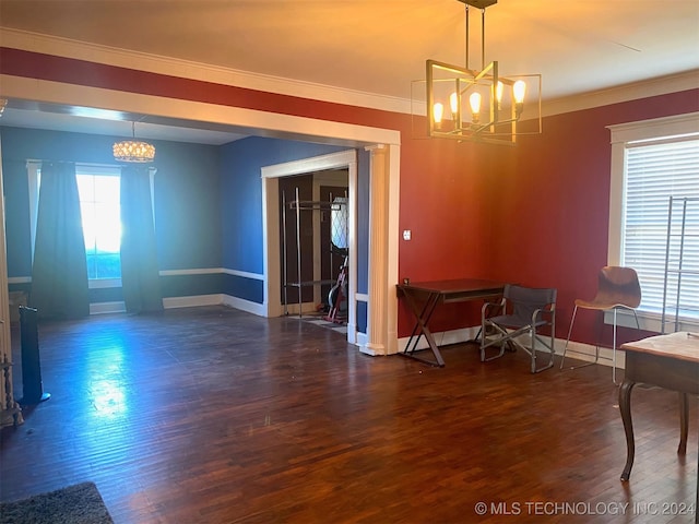 dining area with crown molding, dark hardwood / wood-style flooring, and a notable chandelier