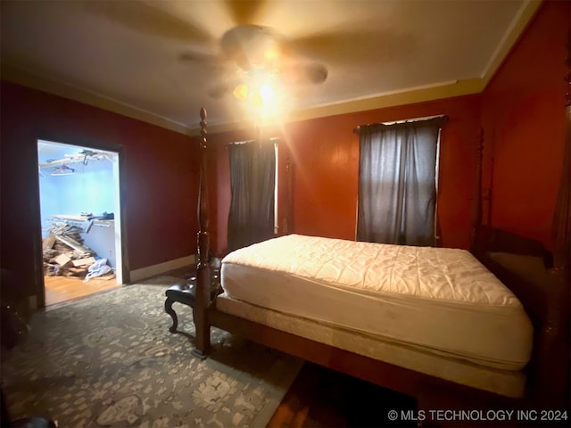 bedroom featuring ceiling fan and crown molding