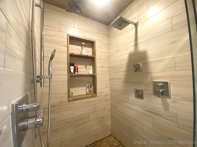 bathroom with tiled shower