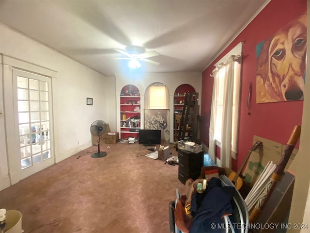 miscellaneous room with carpet flooring, crown molding, and ceiling fan