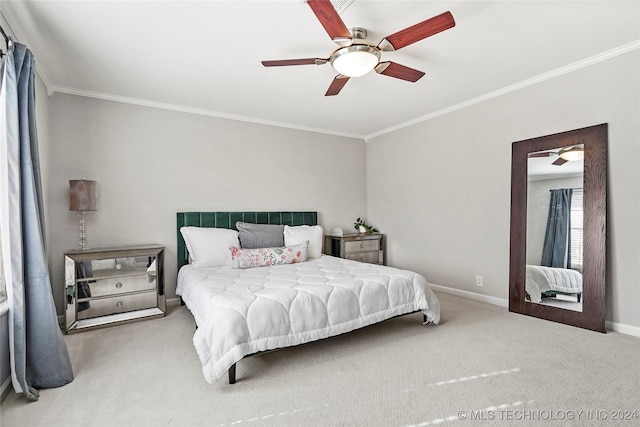 bedroom featuring ceiling fan, carpet floors, and crown molding